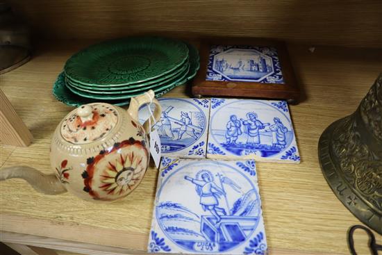 A Creamware teapot, green leaf plates and Delft tiles